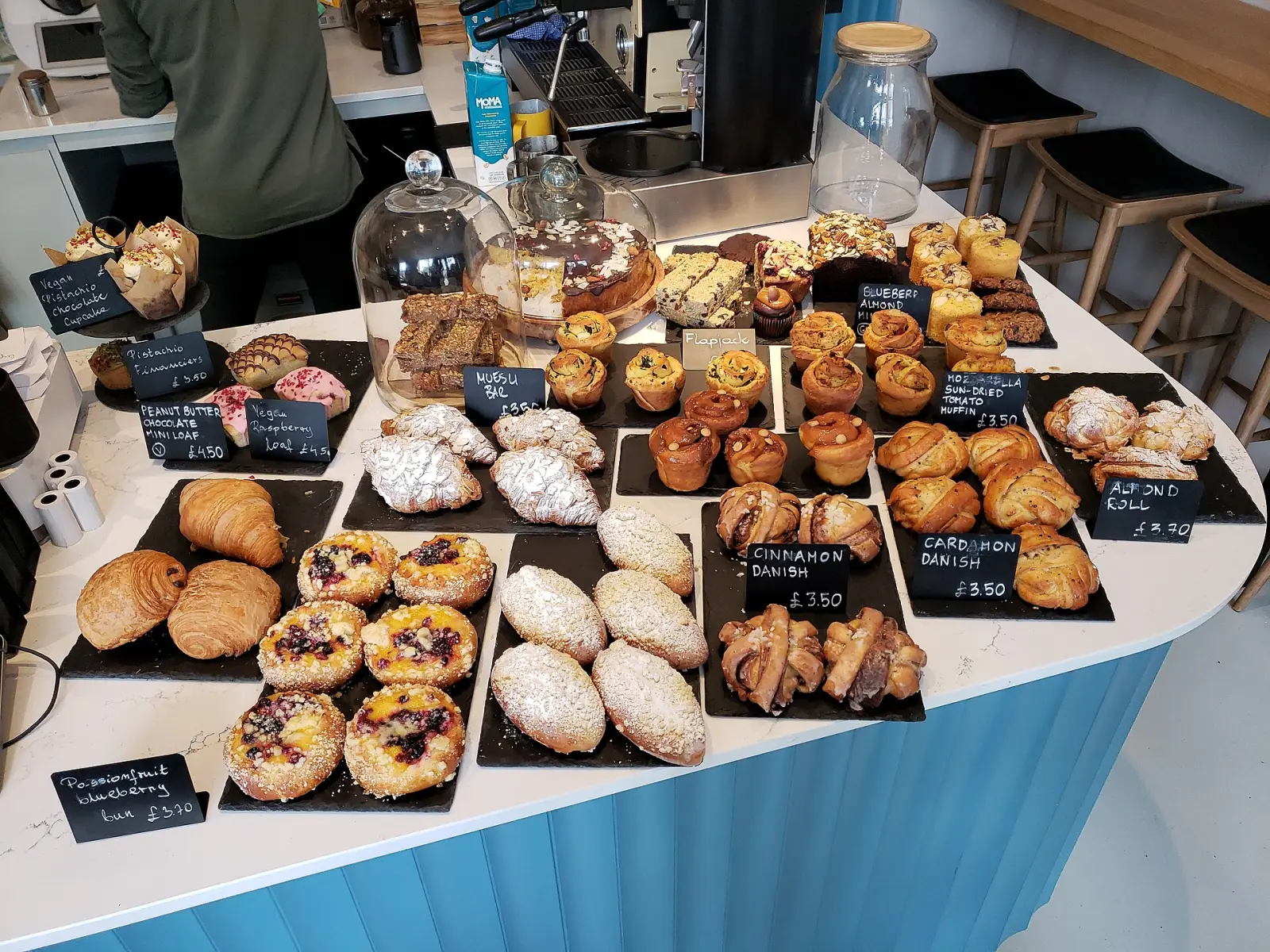 Breads and pastries on a bakery counter. The photo was not taken at a Johns Creek bakery.
