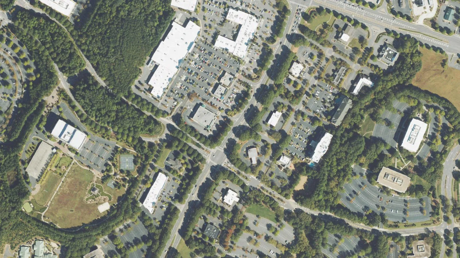 Medlock Bridge Road and the streets around it near Johns Creek Town Center, seen from the air. The picture does not show the area as it is today.