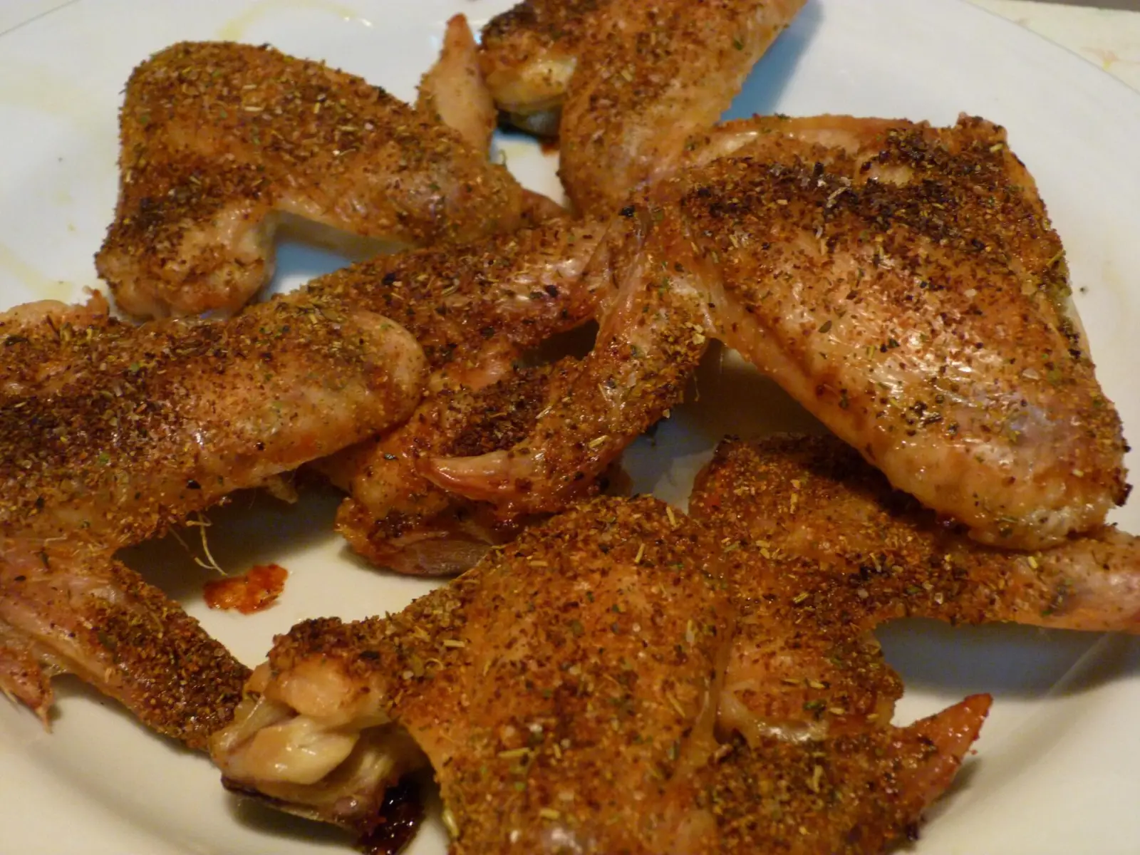 A plate of seasoned chicken wings. The photo was not taken at a Johns Creek restaurant.